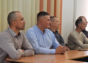 Grupa uczestników warsztatów w sali wykładowej
